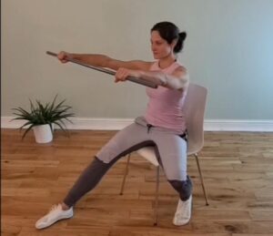 Kathi performing seated Qigong to help with her chronic pain management